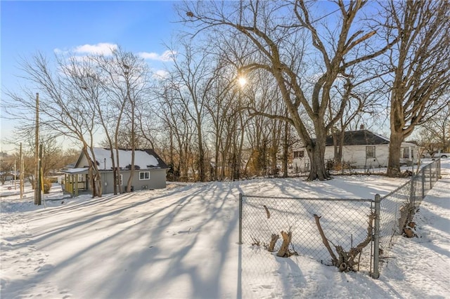 view of yard layered in snow