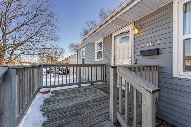 view of snow covered deck