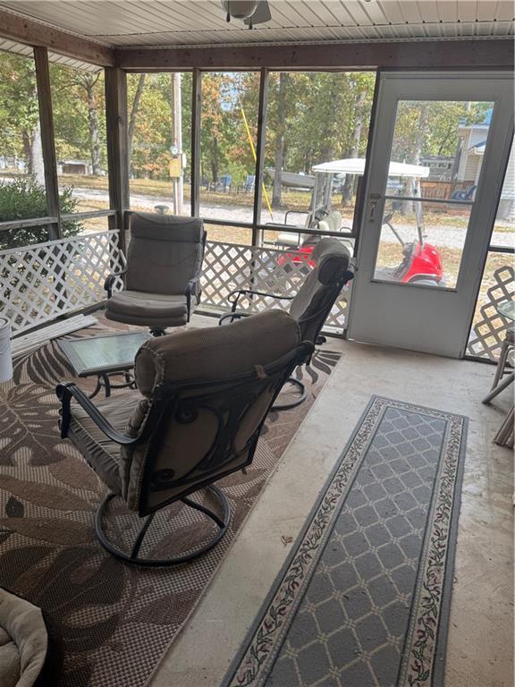 sunroom featuring wood ceiling