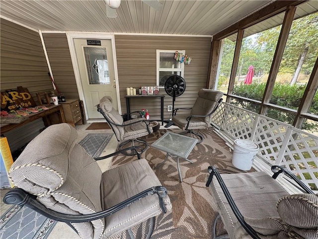 sunroom featuring ceiling fan