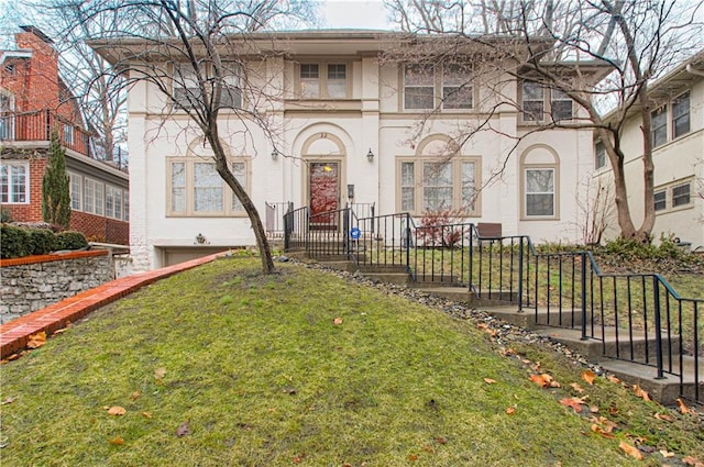 view of front of home with a front lawn