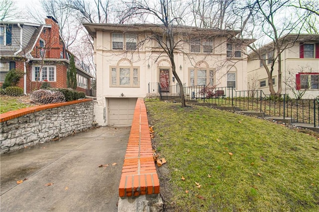 view of front of home with a garage and a front yard