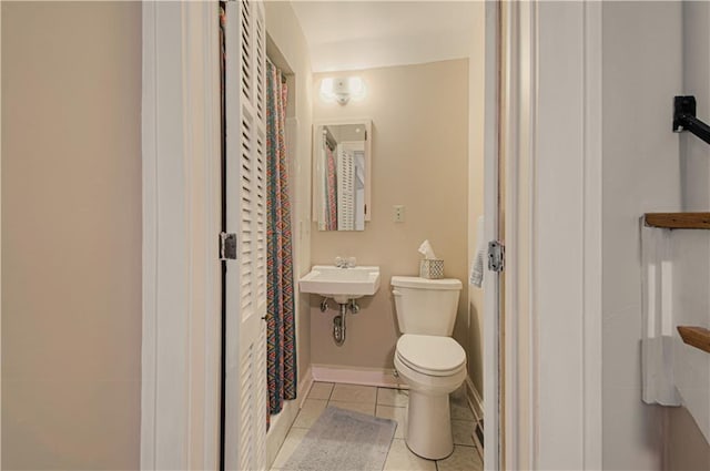 bathroom featuring tile patterned floors and toilet