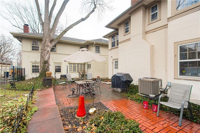 view of patio / terrace featuring area for grilling and central air condition unit