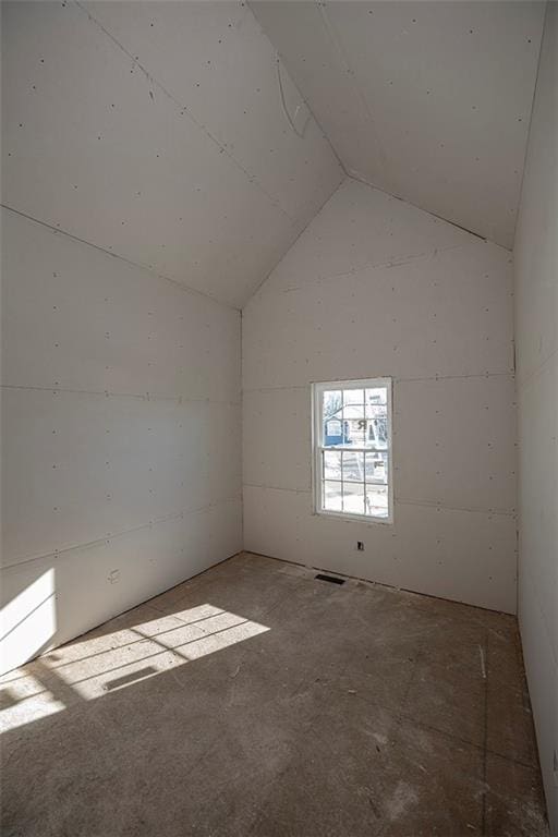 empty room with vaulted ceiling