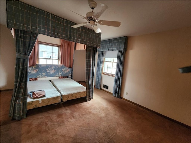 unfurnished bedroom featuring carpet flooring and ceiling fan