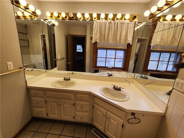 bathroom with vanity and tile patterned floors