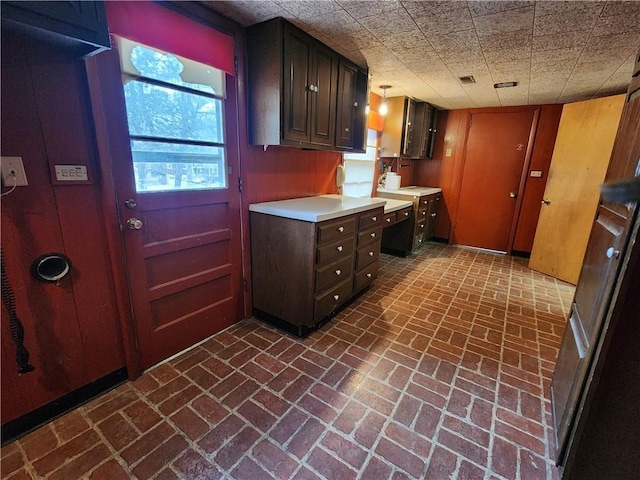 kitchen with dark brown cabinetry