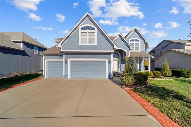 view of front of property with a front lawn and a garage