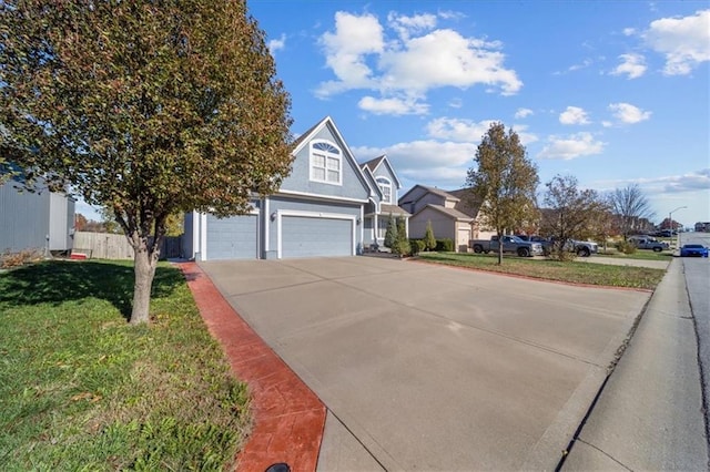 view of front of property featuring a front yard and a garage