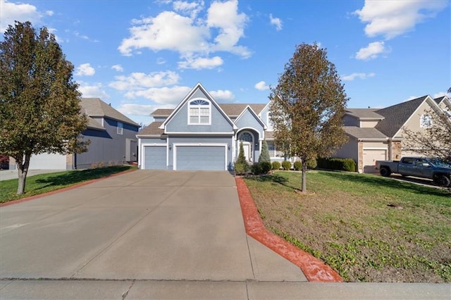 view of front of house with a front lawn and a garage