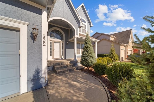 view of exterior entry featuring a garage