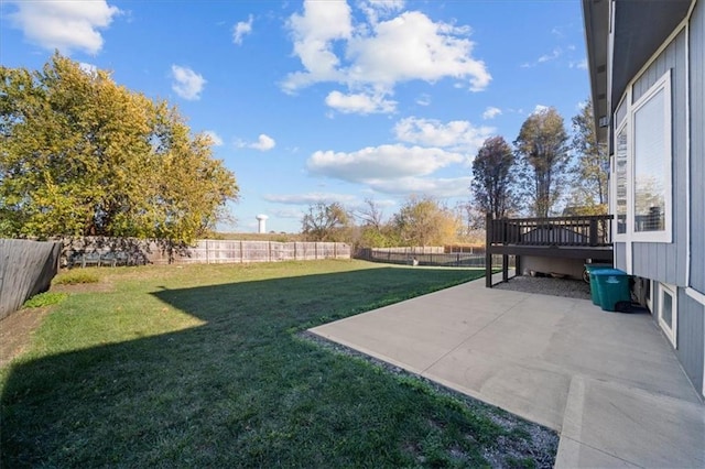 view of yard with a patio area and a wooden deck