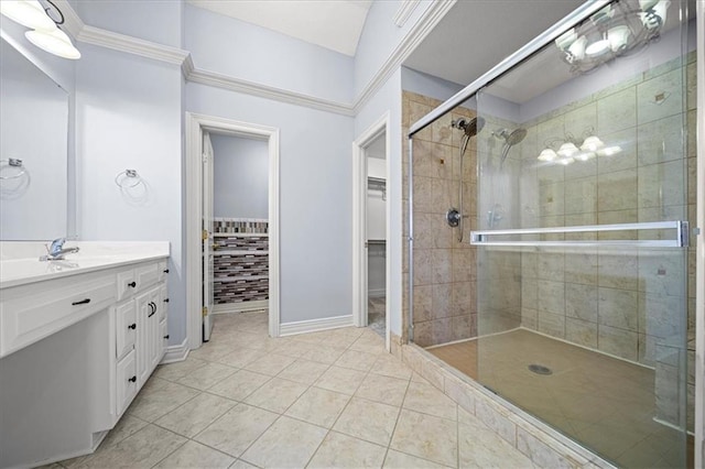 bathroom featuring an enclosed shower, vanity, and tile patterned flooring