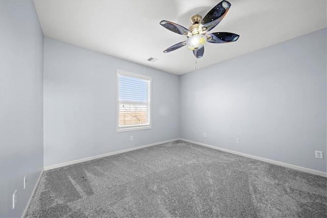 spare room with carpet floors and ceiling fan