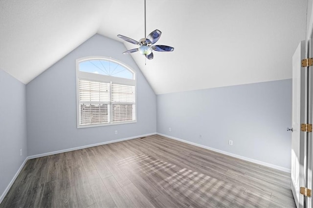 additional living space featuring ceiling fan, wood-type flooring, and lofted ceiling