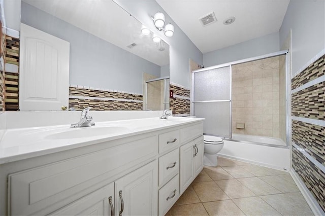 full bathroom featuring toilet, enclosed tub / shower combo, decorative backsplash, tile patterned floors, and vanity