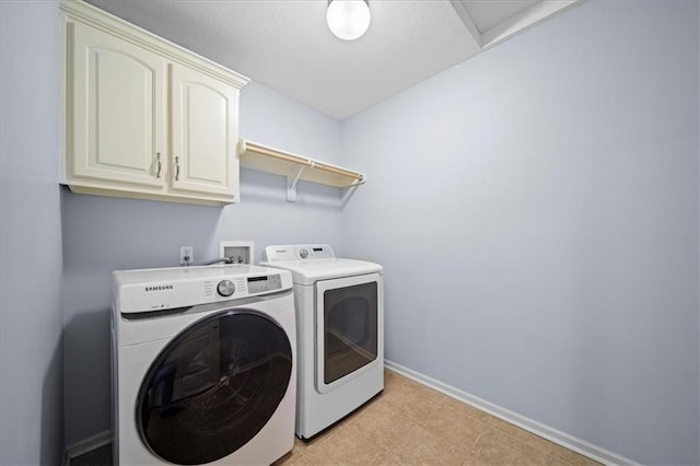 laundry area with cabinets and washer and dryer