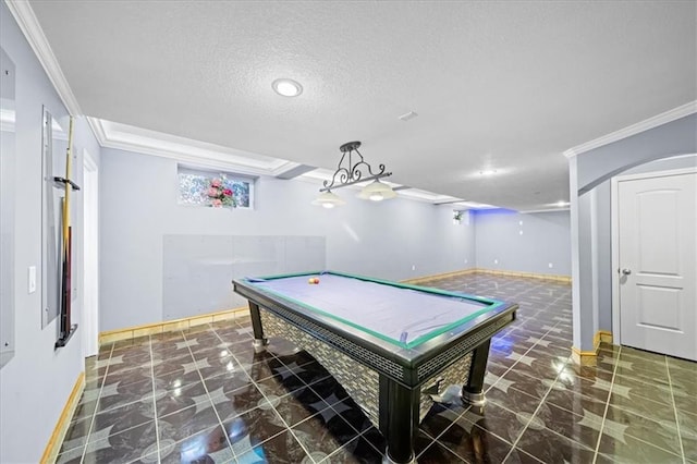 recreation room with a textured ceiling, pool table, and crown molding