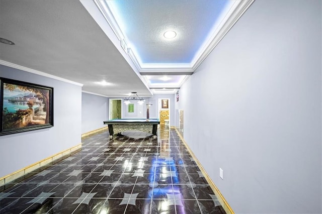 game room featuring a textured ceiling, crown molding, and pool table