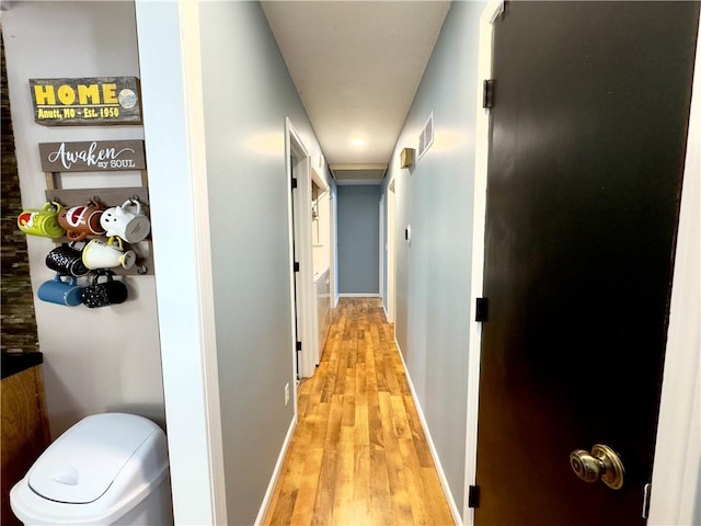 corridor featuring light wood-type flooring