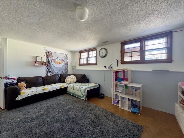 living room featuring a textured ceiling