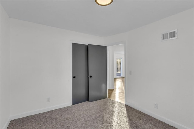 unfurnished bedroom featuring carpet flooring