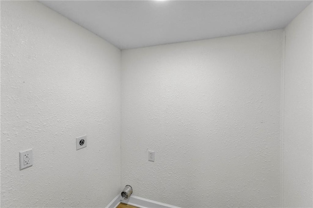 laundry area with hardwood / wood-style floors and hookup for an electric dryer