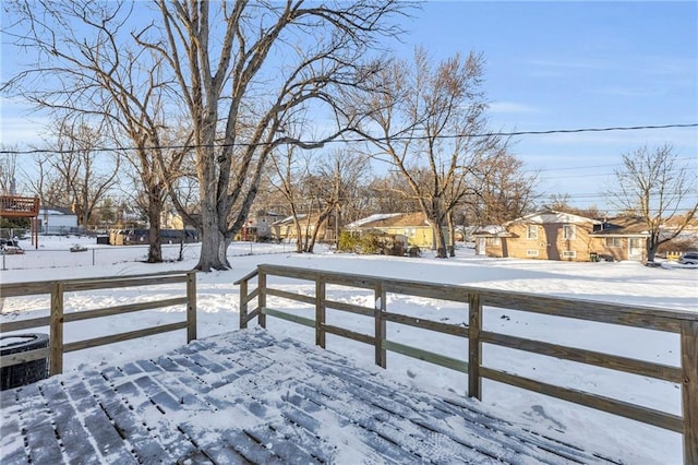 view of snow covered deck