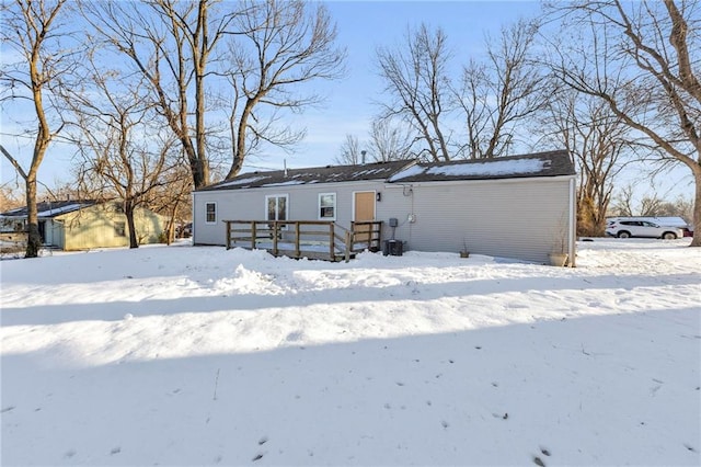 view of snow covered house