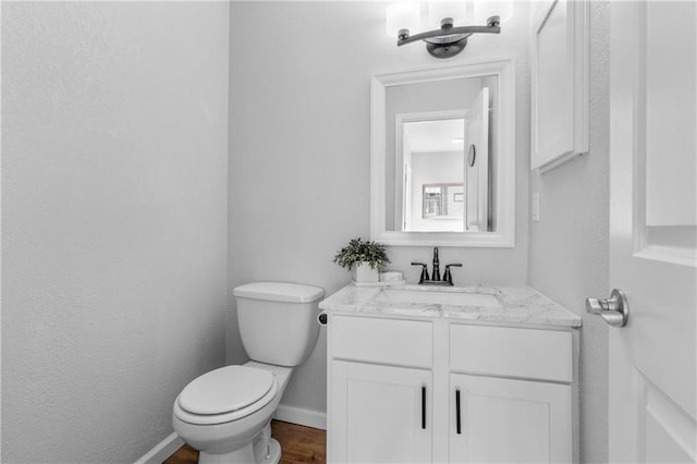 bathroom with toilet and vanity