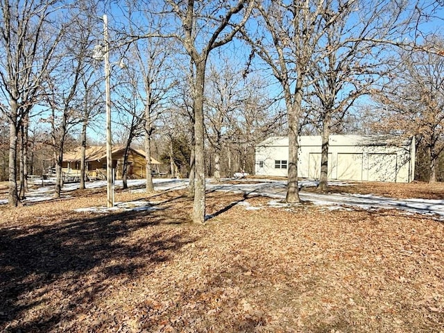 view of yard layered in snow