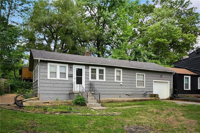 single story home with a front lawn and a garage