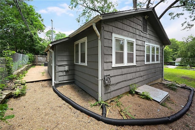 view of property exterior featuring a deck