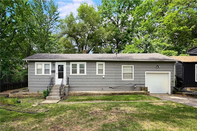 view of front facade featuring a garage and a front lawn