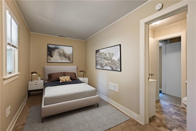 bedroom with carpet floors, ornamental molding, connected bathroom, and multiple windows