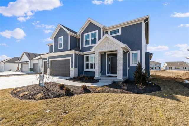 view of front of home with a garage and a front lawn