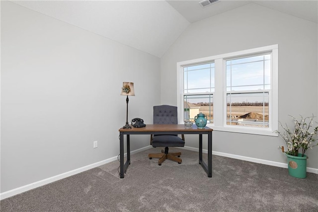 carpeted office featuring lofted ceiling