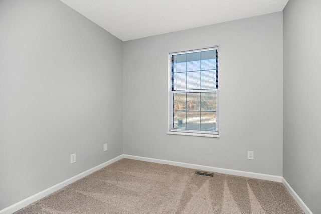 unfurnished room featuring carpet floors