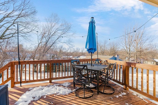 view of snow covered deck