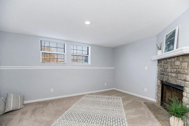 interior space featuring light carpet and a stone fireplace