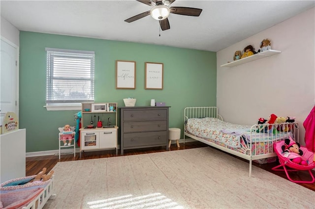 bedroom featuring ceiling fan and dark hardwood / wood-style floors