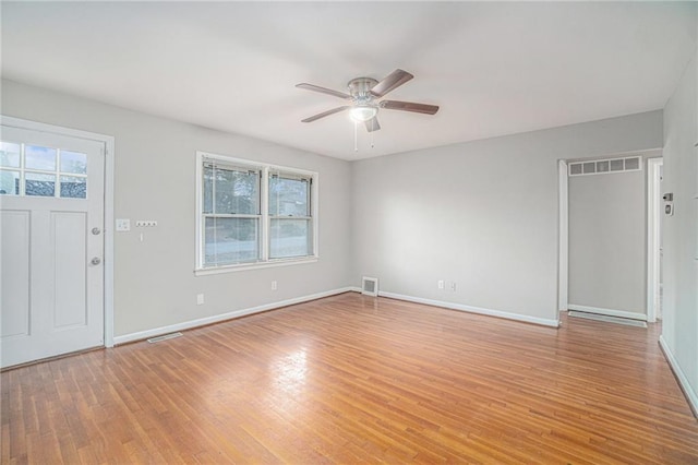 entryway with ceiling fan and light hardwood / wood-style flooring