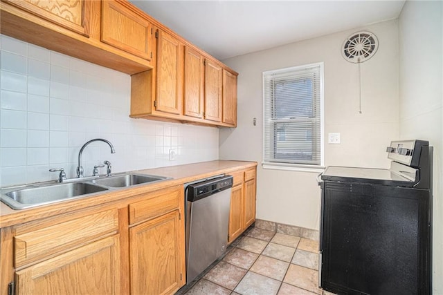 kitchen with backsplash, dishwasher, washer / clothes dryer, sink, and light tile patterned floors