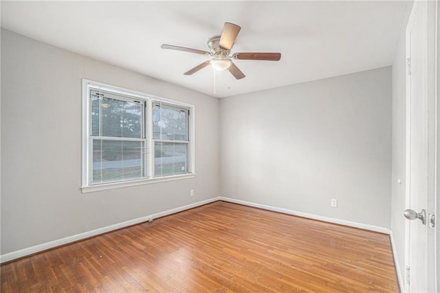 empty room featuring ceiling fan and hardwood / wood-style flooring