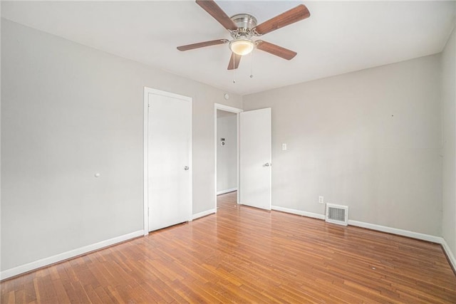 spare room featuring ceiling fan and wood-type flooring