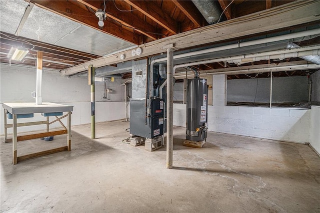 basement featuring heating unit and gas water heater