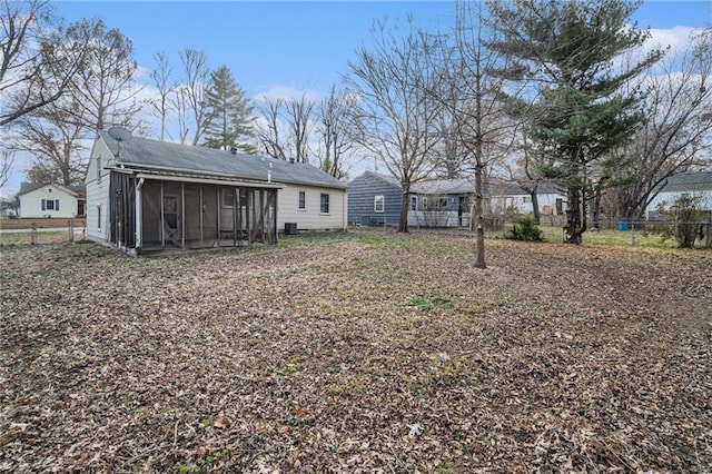 view of yard featuring a sunroom