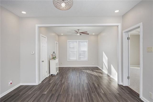 interior space with ceiling fan and dark hardwood / wood-style floors