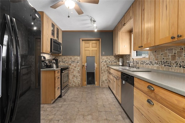 kitchen with ceiling fan, sink, tasteful backsplash, and stainless steel appliances